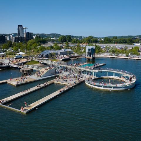 The park seen from the river, with the swimming arena and sauna in the front