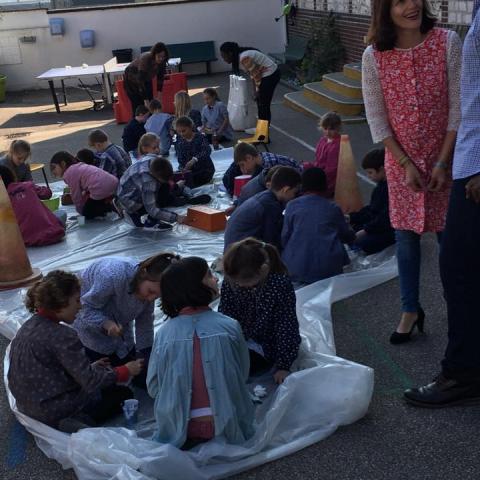 Children working on the interior vegetal wall plants